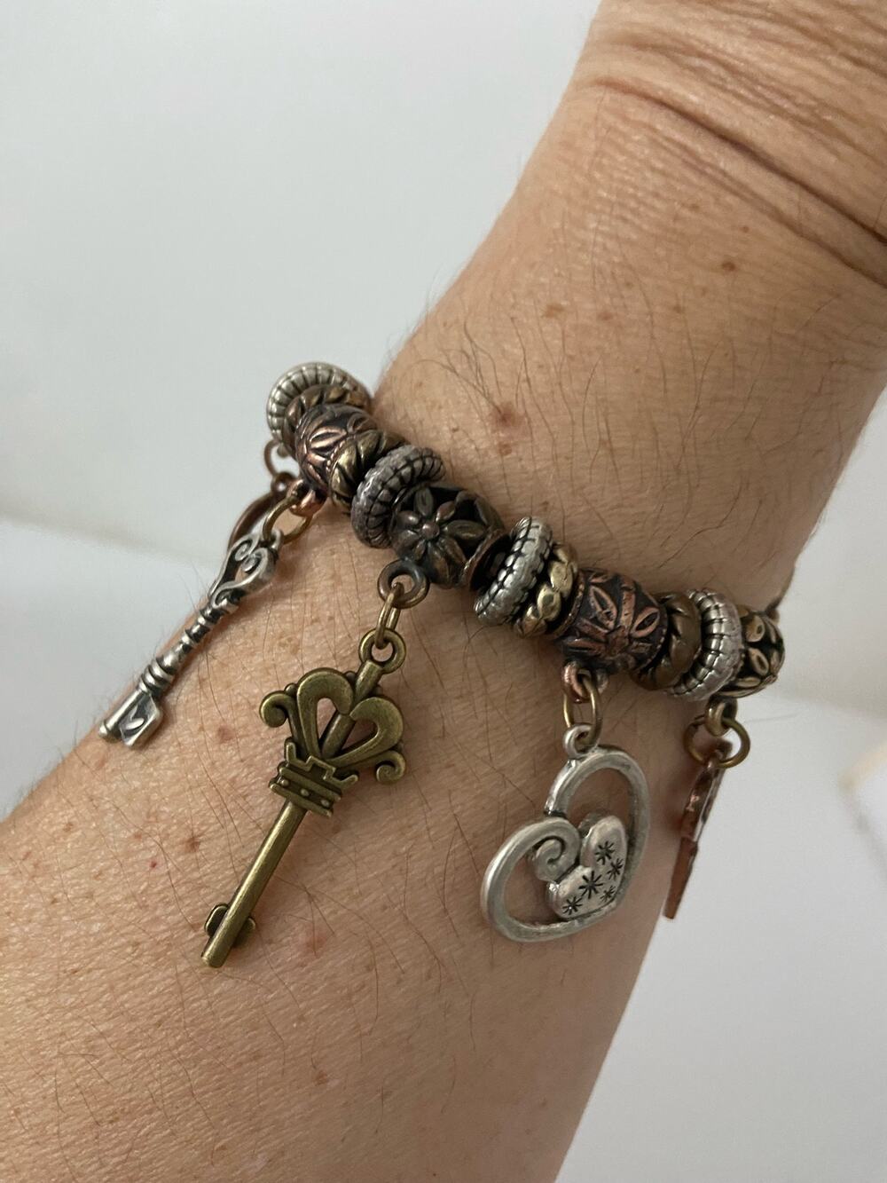 Copper tone key charm bracelet